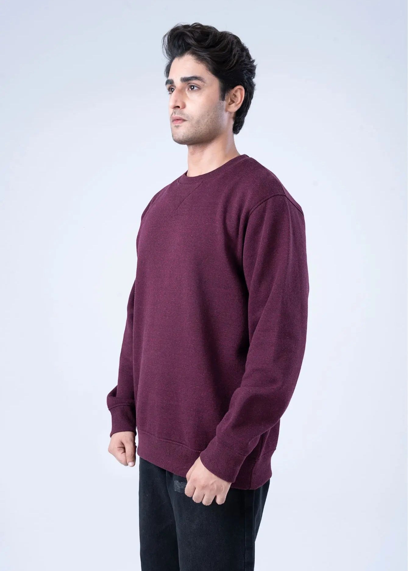 Men's burgundy crewneck terry sweatshirt, side view with long sleeves and cuffs