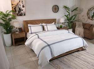 White cotton sateen duvet cover set with gray-blue plaid stripes and matching pillowcases