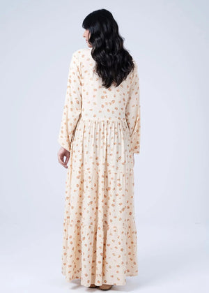Women's printed long dress in light beige with gathered waist and long sleeves, back