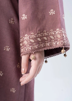 Embroidered tunic sleeve detail with lace trim and dangling tassel trim