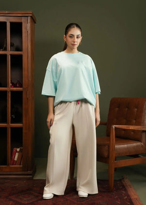 Light blue knitted crew-neck top with short sleeves, relaxed fit