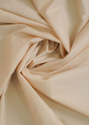 Light fawn dobby fabric with subtle textured pattern