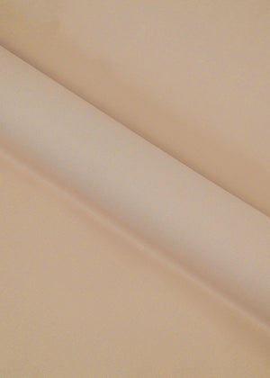 Fawn dobby fabric with fine woven texture in close-up