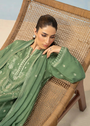 Green suit with flowing dupatta and detailed neckline embroidery