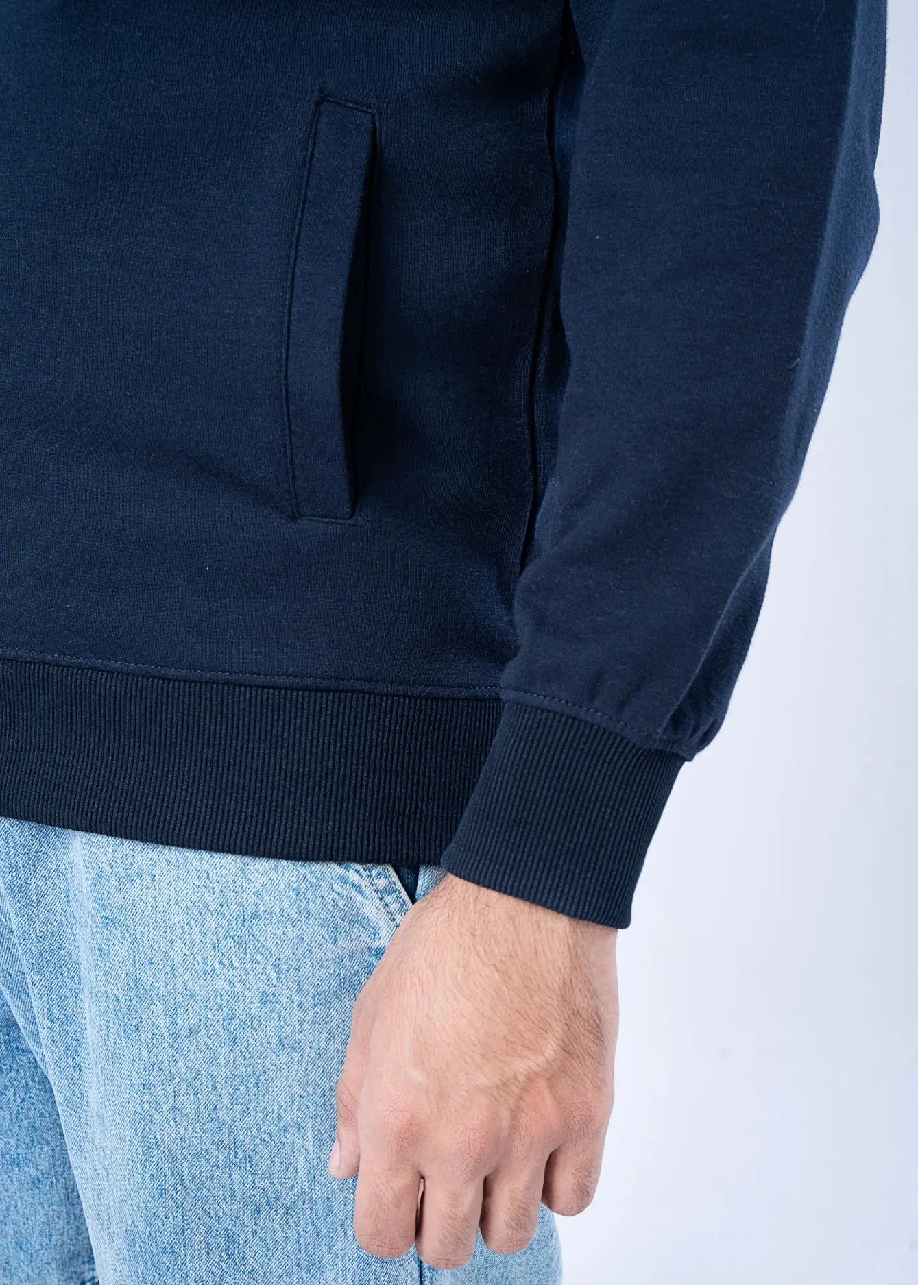 Navy fleece hoodie sleeve and front pocket, ribbed hem and cuffs
