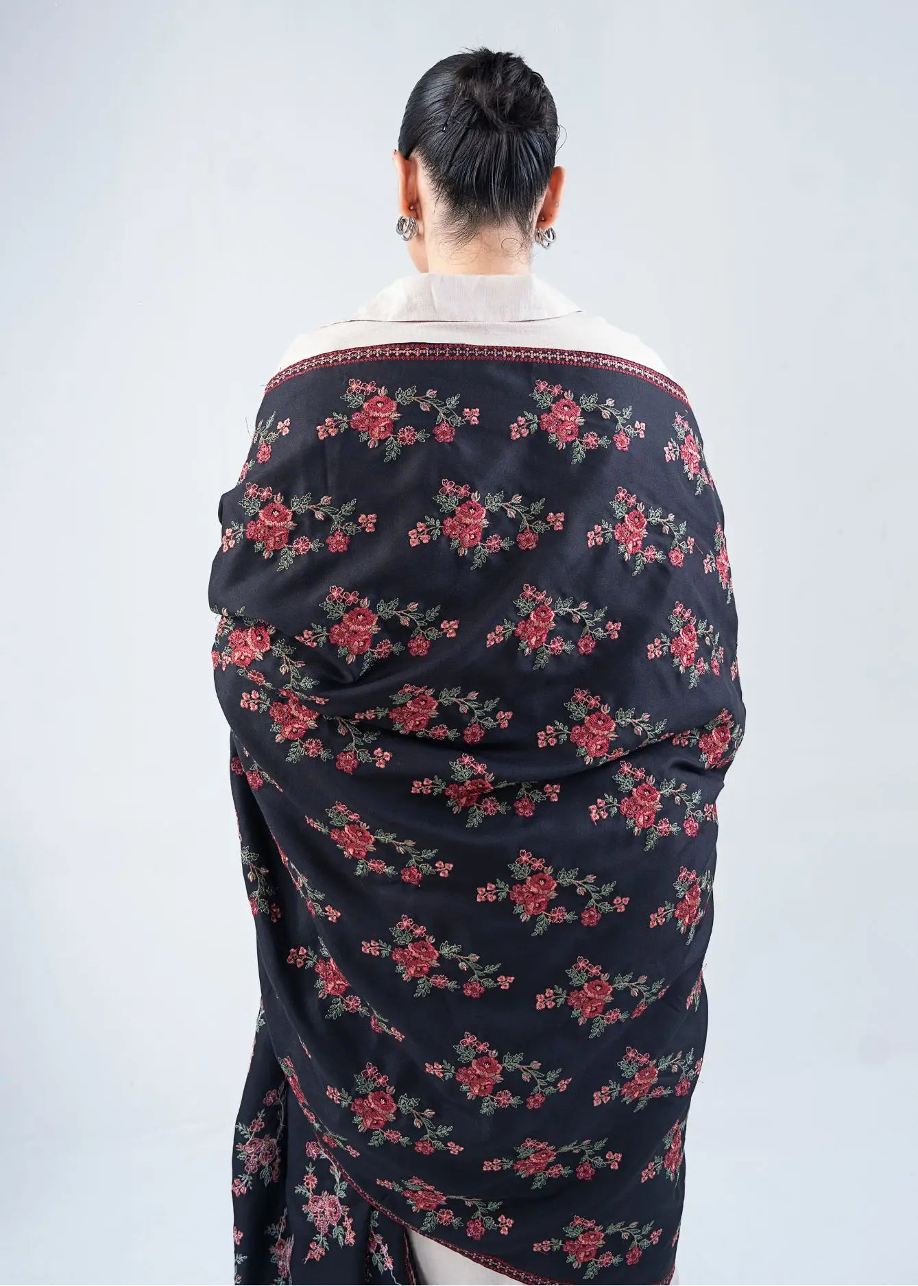 Black wool winter shawl with red floral pattern and cream-edged back trim