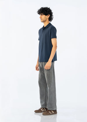 Men's dark polo shirt with short sleeves, side view showing collar and placket