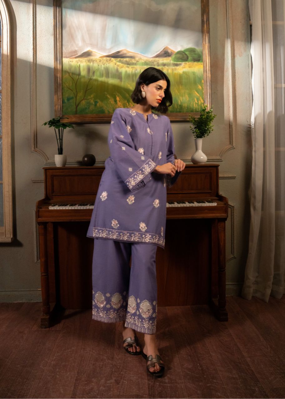 Women's purple embroidered tunic and pants set, front view with floral motifs