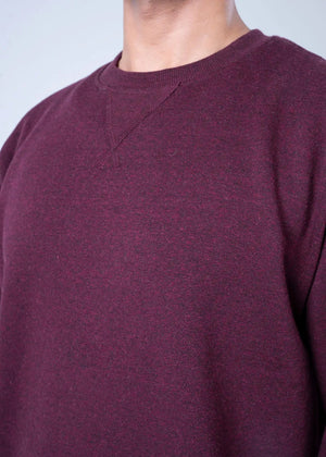 Burgundy terry sweatshirt fabric close-up of crew neckline and textured surface