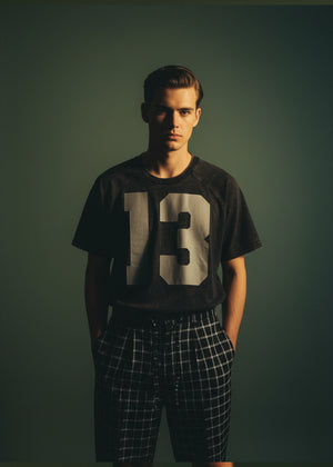 Black short-sleeve crewneck t-shirt with large white '13' front graphic