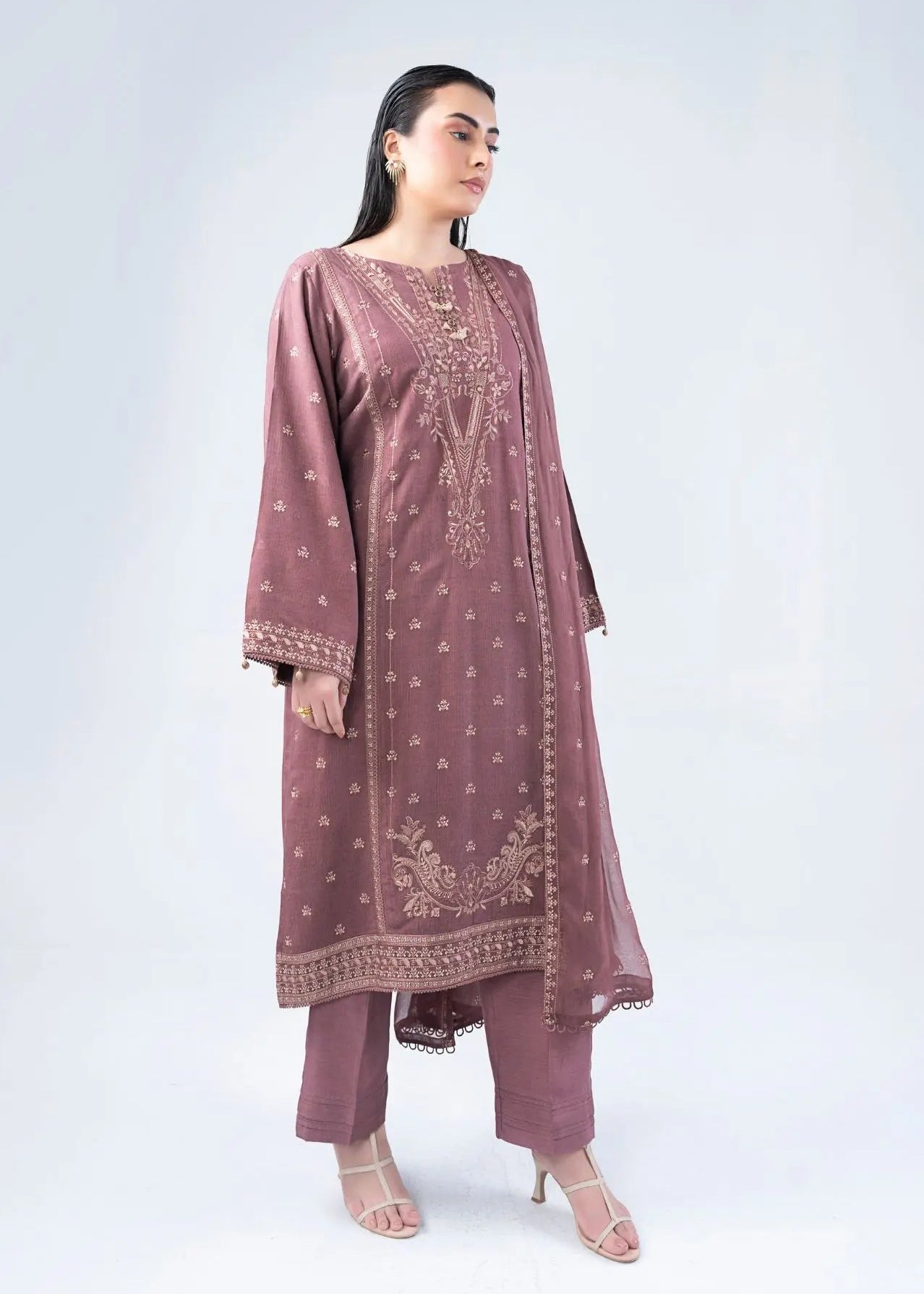 Women’s embroidered long tunic suit with decorative border and matching pants