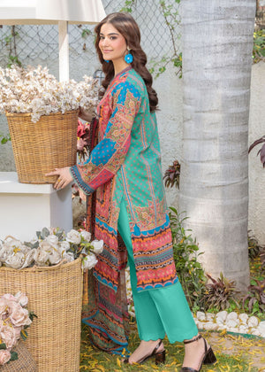Women's multicolor printed long tunic with teal pants, V-neck long sleeves, side view.