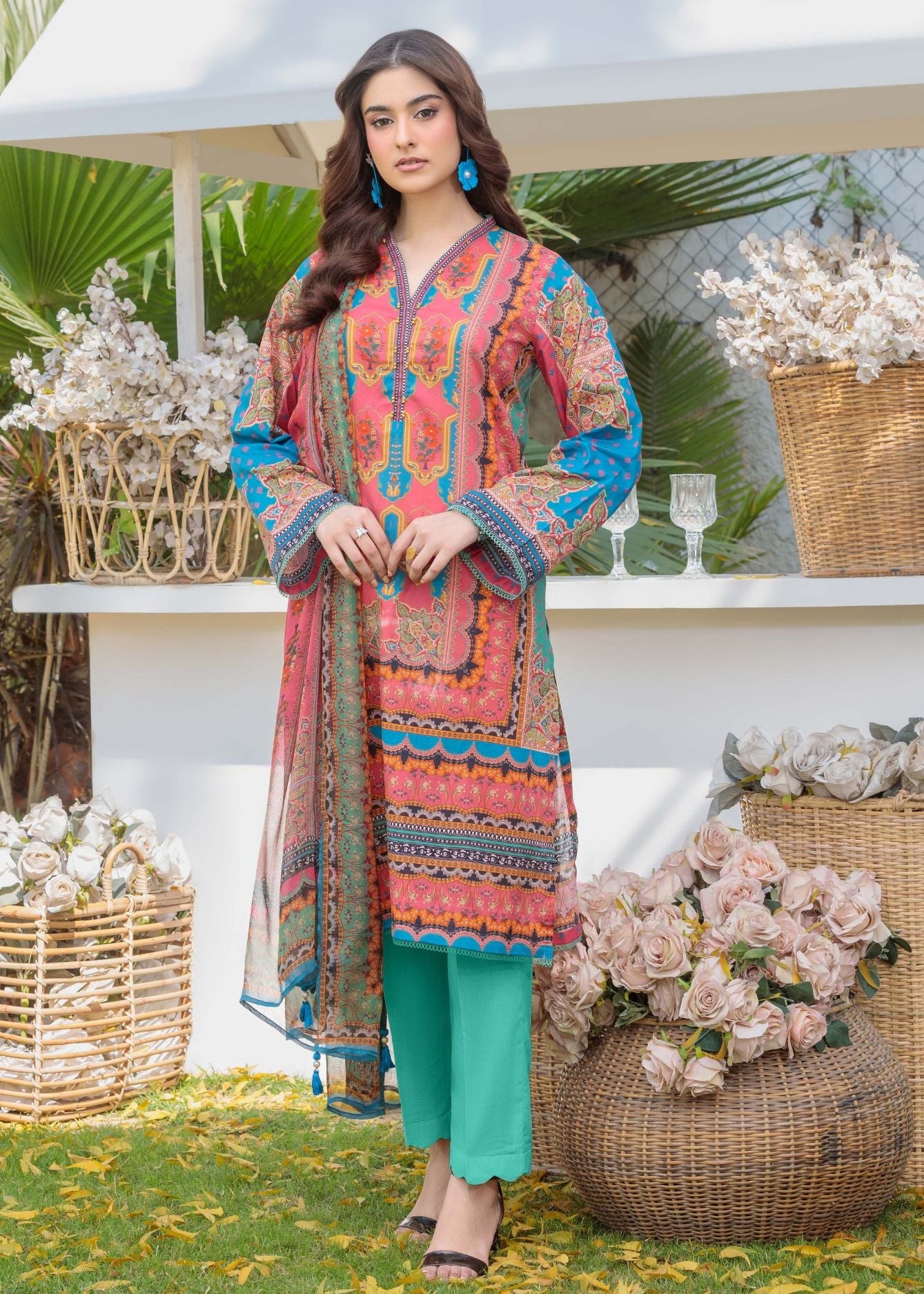 Women's multicolor printed kurta set with teal straight pants, long sleeves and V-neck.