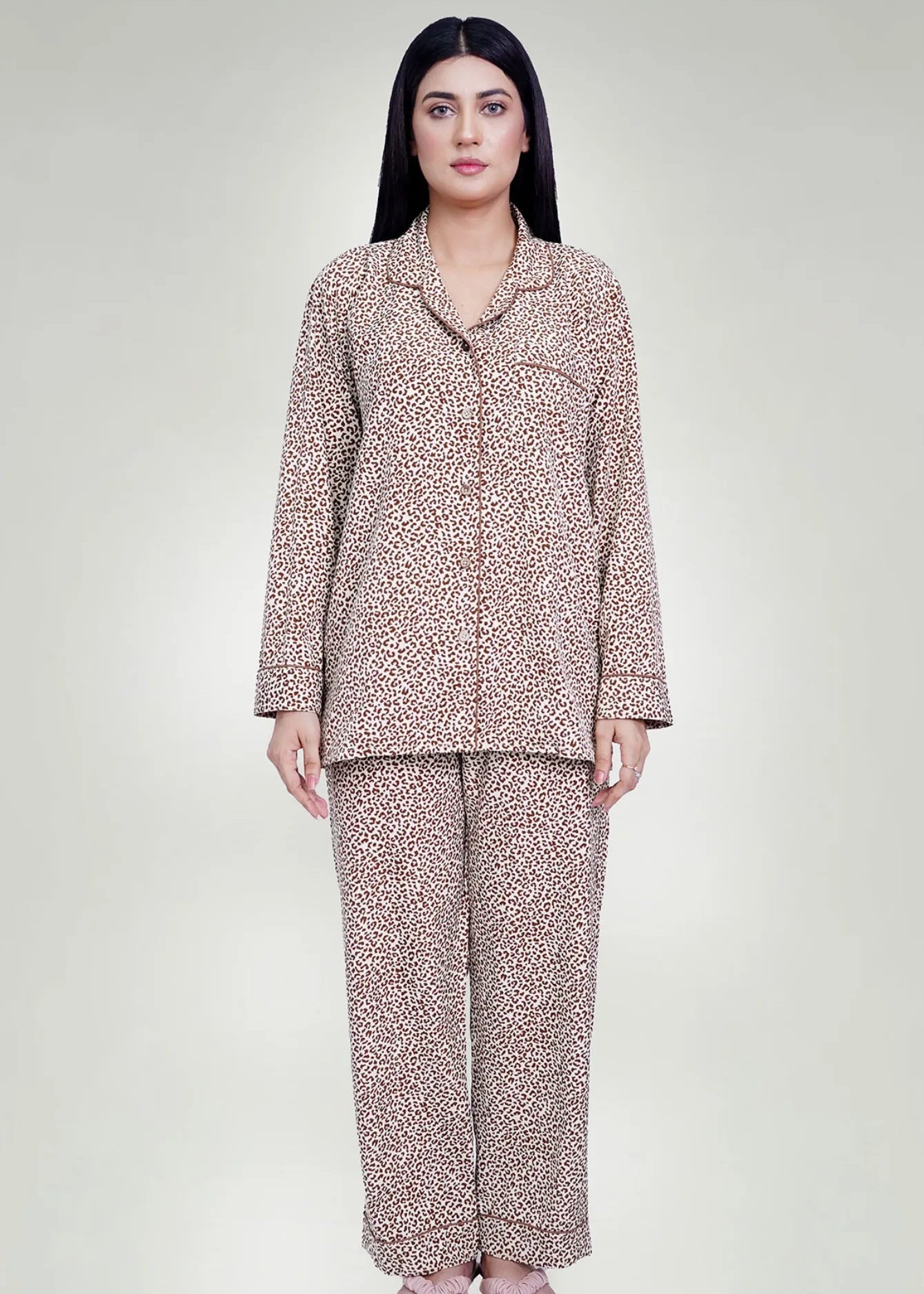 Men's silk night suit set in tan and brown leopard print, long-sleeve top and pants.