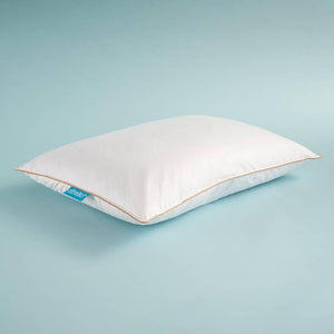 White down-filled pillow, angled view, with orange piping and blue brand tag.