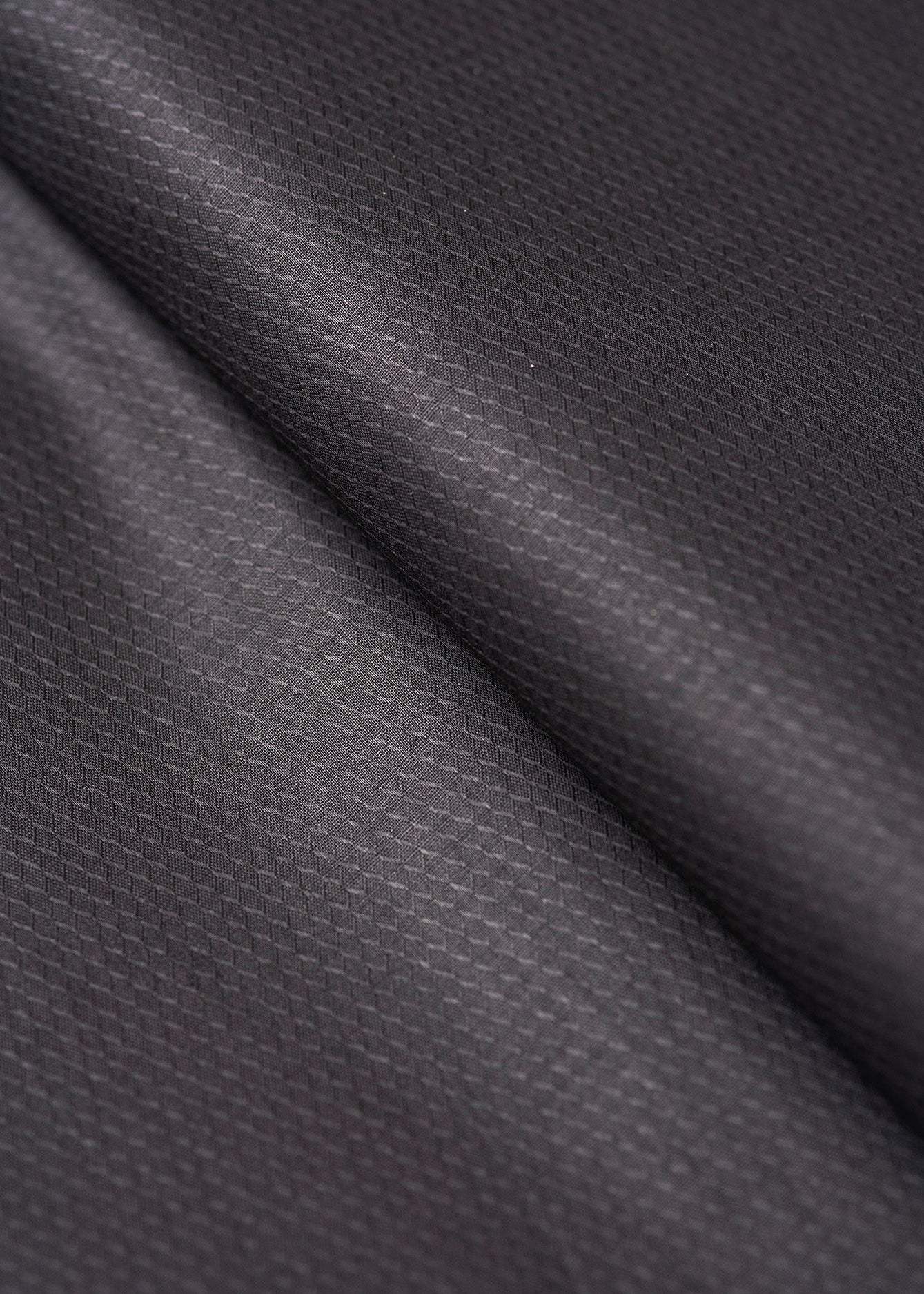Black cotton fabric texture close-up