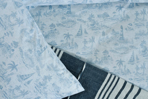 Nautica printed duvet cover corner with light blue fabric and navy-and-white striped trim