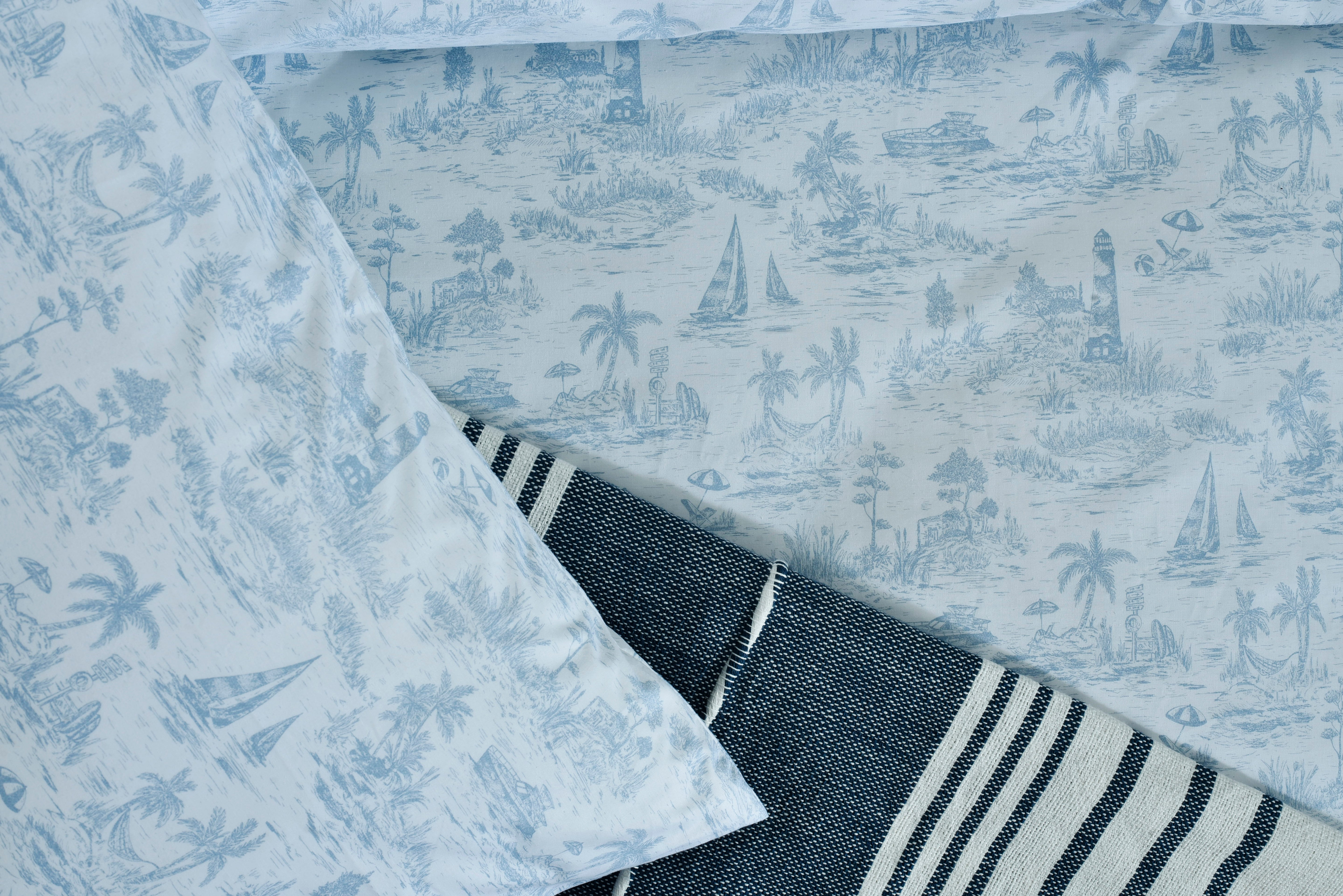 Nautica printed duvet cover corner with light blue fabric and navy-and-white striped trim