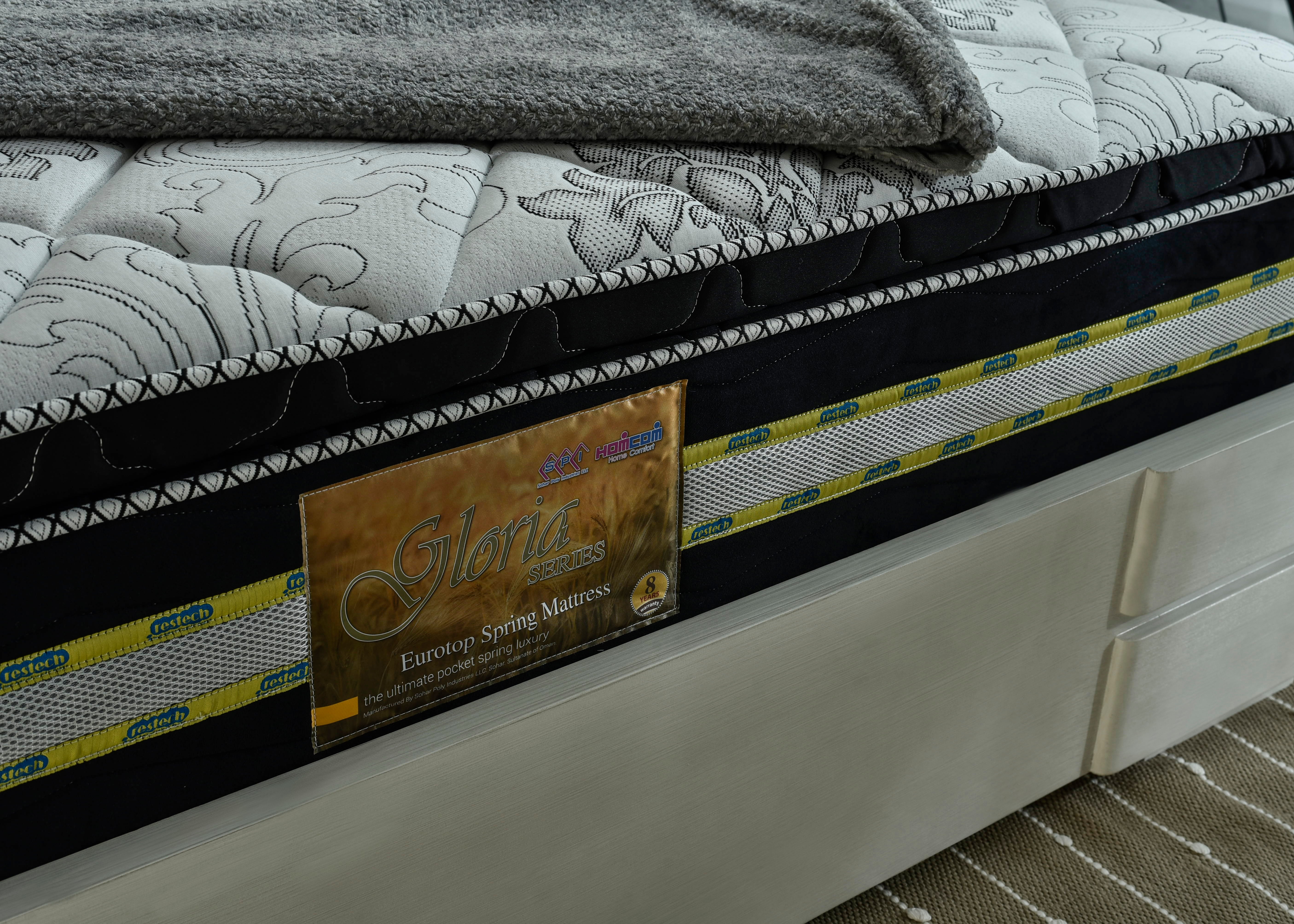 Eurotop spring mattress with branded tag and black stitched edge