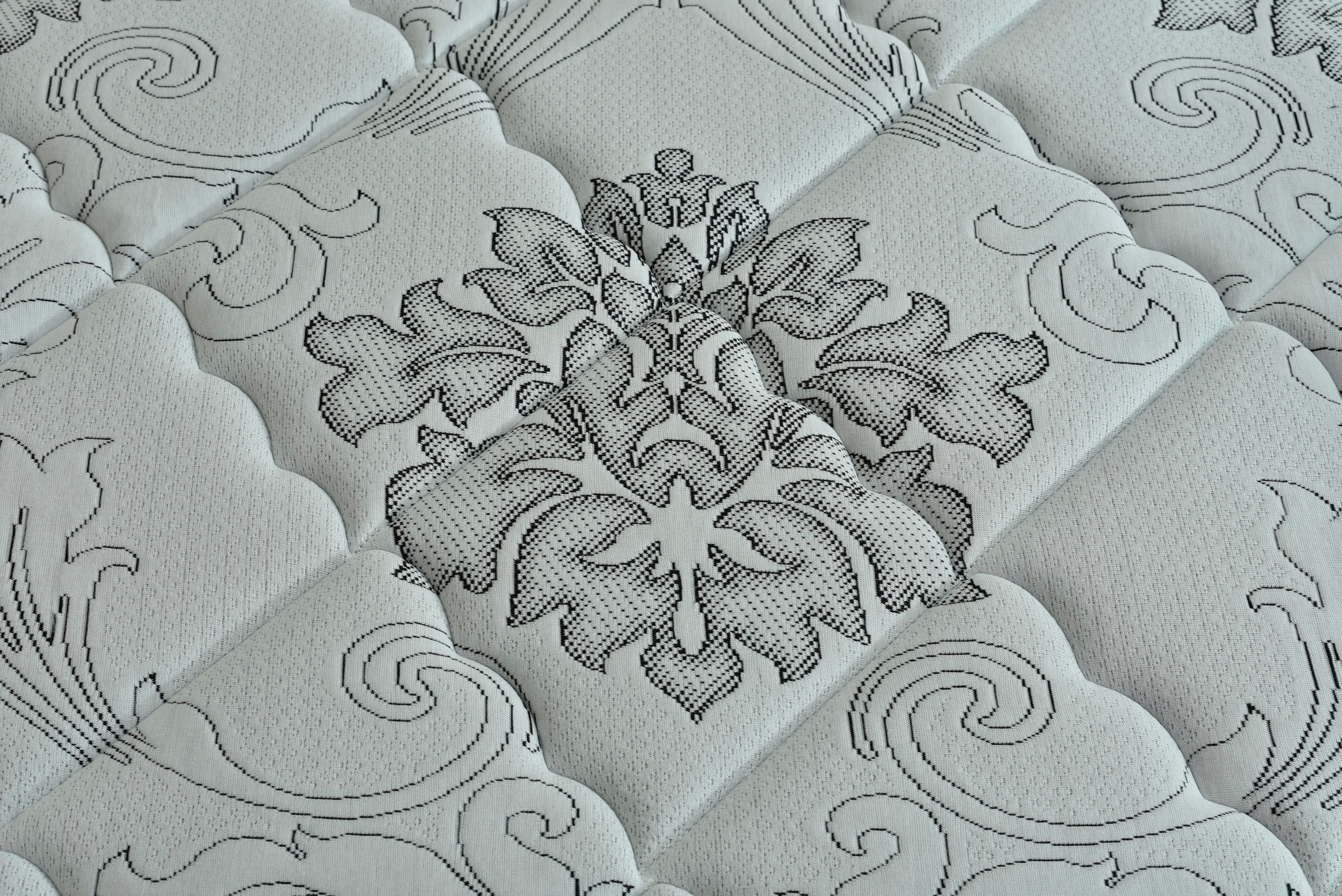 Eurotop spring mattress quilted cover with large floral medallion design