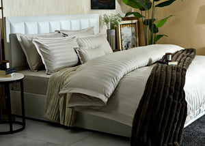7-piece duvet cover set with beige striped duvet and coordinating pillow shams