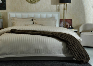 7-piece duvet cover set with light striped duvet and matching pillow shams
