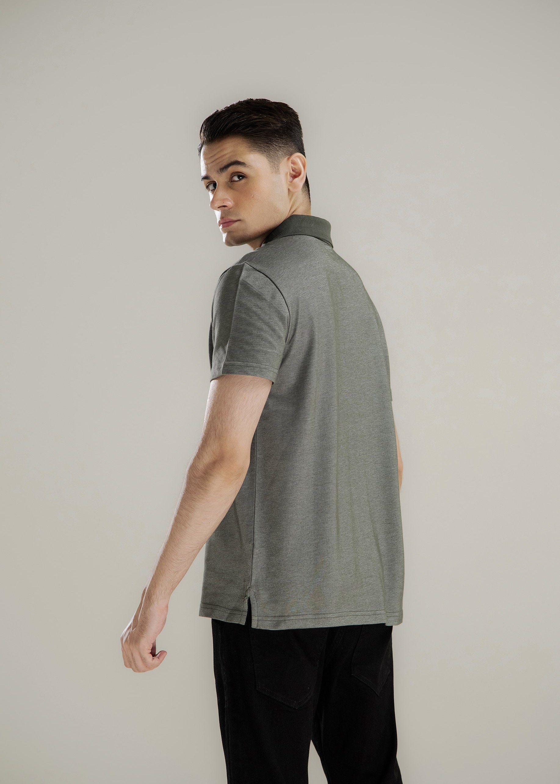 Men's polo shirt, dark gray, side/back view, short sleeves, solid knit