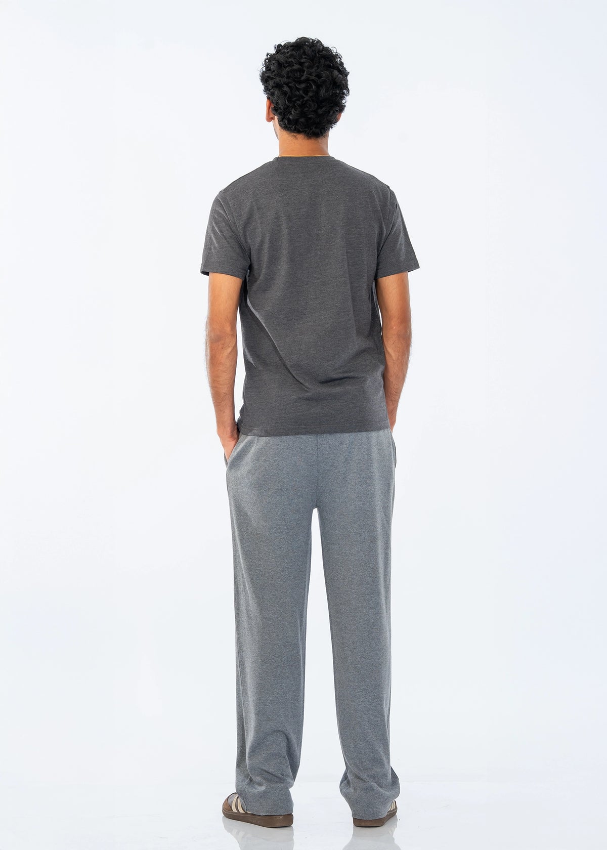 Men's dark grey pull-on trousers, back view with relaxed fit and elastic waist
