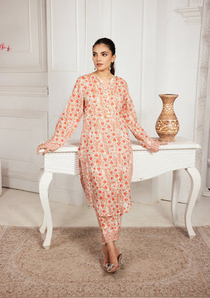 Orange patterned 2-piece suit with long tunic top and tapered matching pants