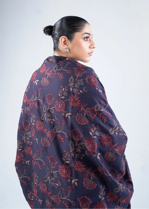 Women's wool winter shawl in dark navy with burgundy floral pattern, draped back view