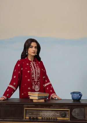 Maroon long kurta suit with white embroidery details and coordinated bottoms