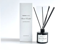 Sweet Rosabel reed diffuser set: black glass bottle with 4 reeds, box included.