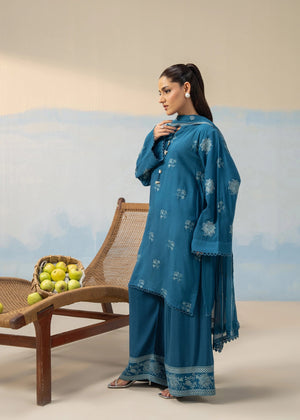 Women's blue embroidered 3-piece suit from back view with flowing dupatta and long pants