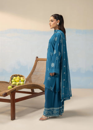 Women's blue embroidered 3-piece suit shown in profile with long kurta and wide-leg pants