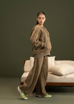 Men's brown terry casual trousers with relaxed straight legs and full-length fit.