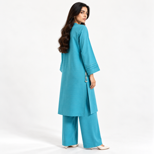 Women's 2-piece suit: side view long tunic and wide-leg pants with tassel accents, teal