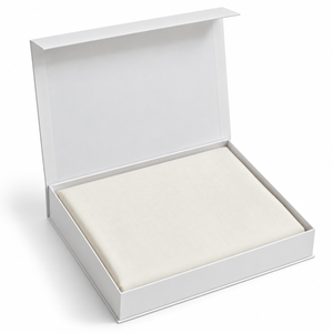 Open box with off-white ready-to-stitch fabric sheet