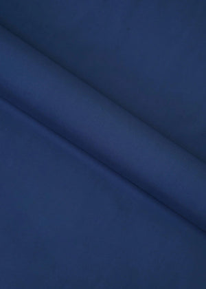 Navy wash-and-wear winter fabric, close-up of smooth folded textile