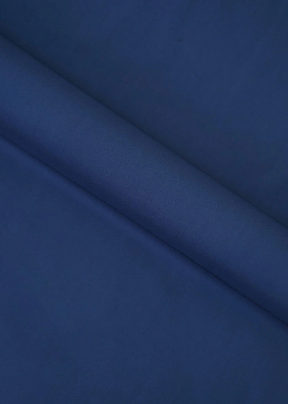 Navy wash-and-wear winter fabric, close-up of smooth folded textile