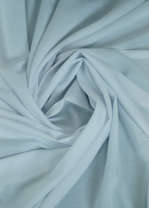 Icy blue fabric with gathered folds, smooth woven texture close-up