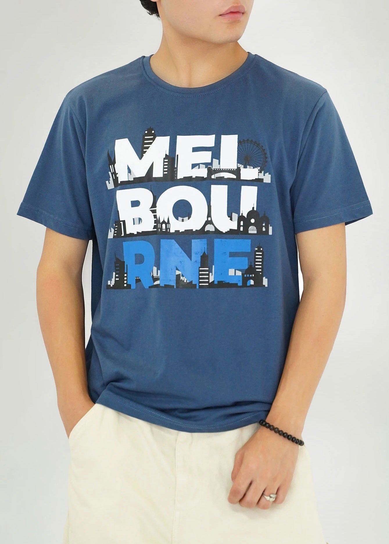 Men's navy round-neck T-shirt with short sleeves and large city skyline graphic