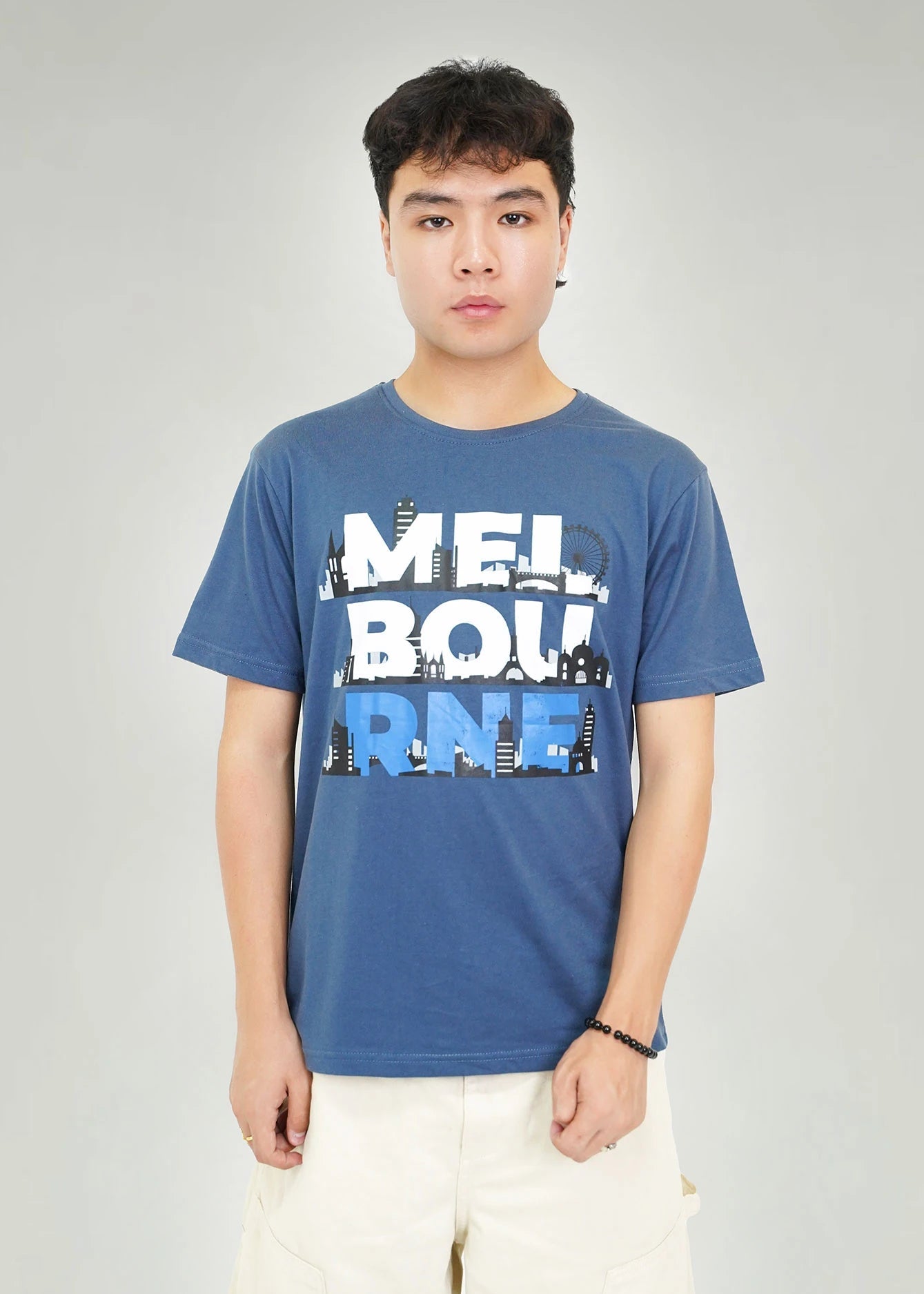 Men's navy round-neck short-sleeve T-shirt with bold city skyline graphic on front
