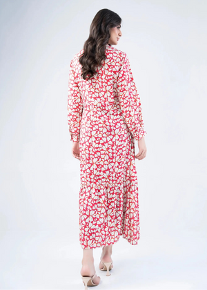Pink and white abstract print long dress with long sleeves and tiered hem
