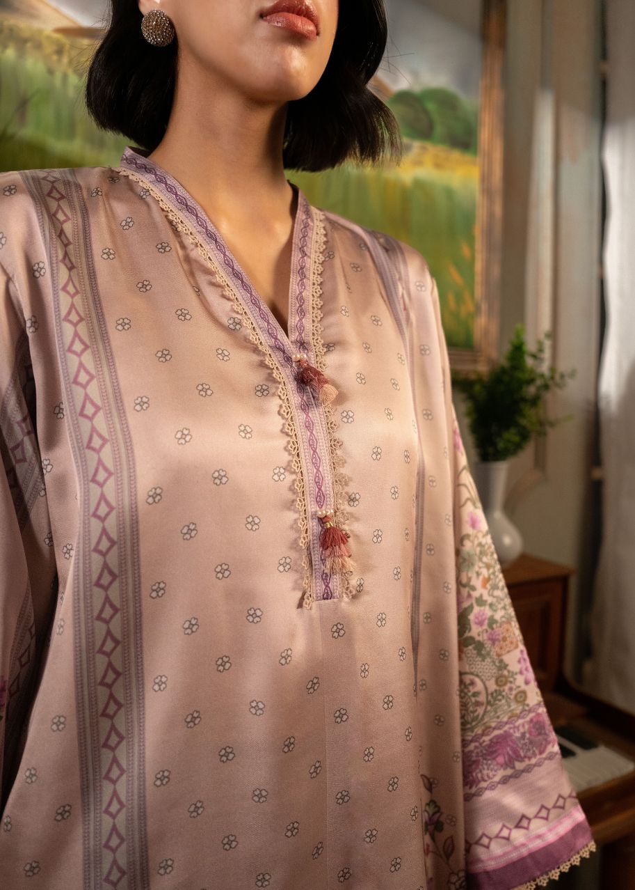 Light pink kurta with purple tassel neckline and floral border on sleeve cuffs