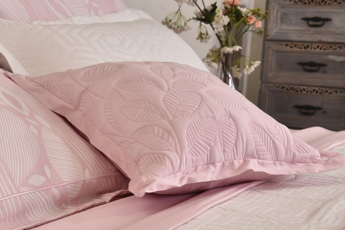 Winter filled cushion in faded pink matelasse jacquard, quilted stitch pattern